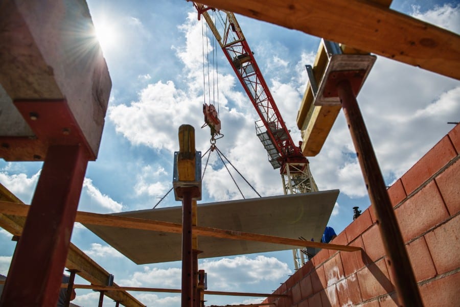 Installation of a prefab floor during the shell construction phase