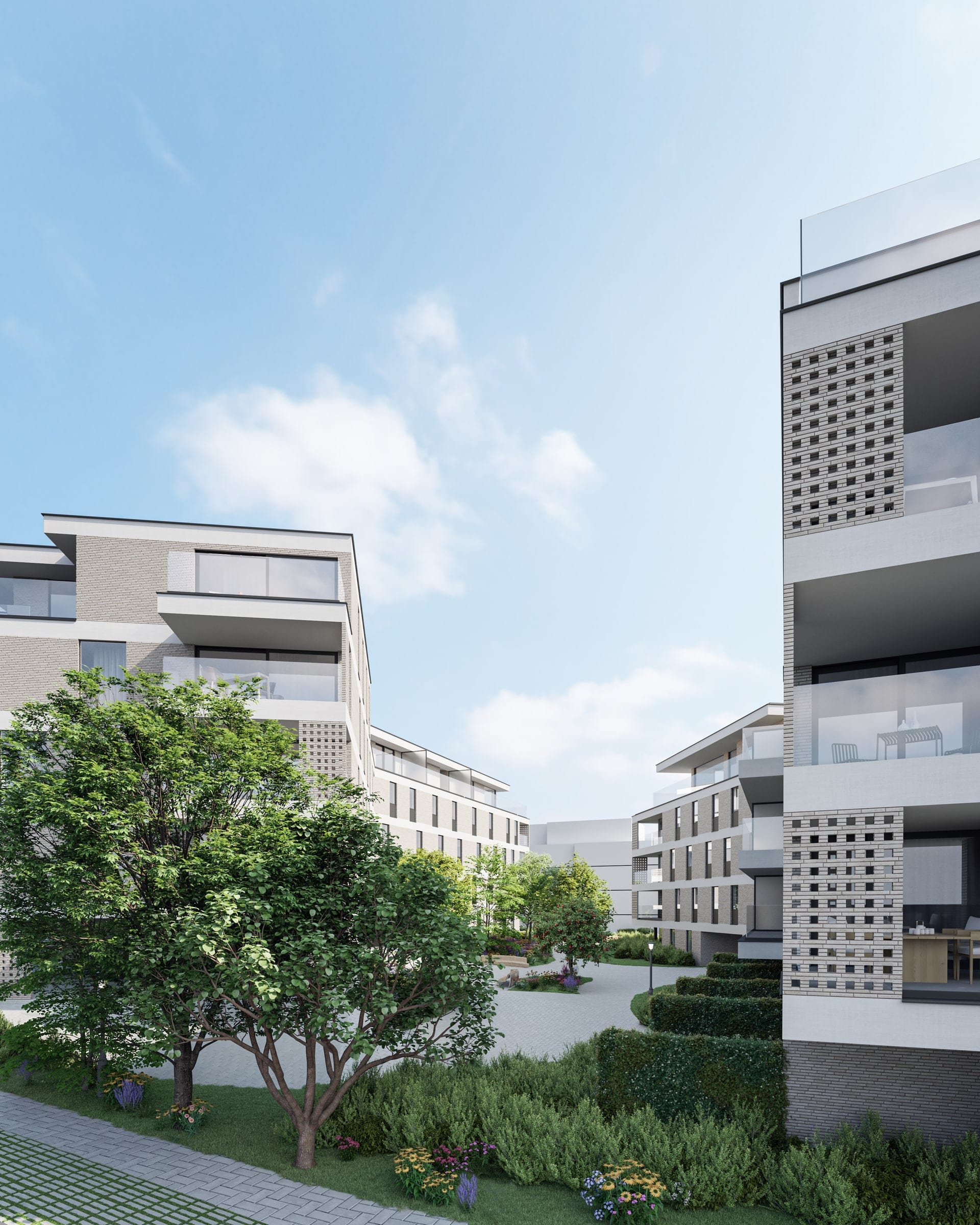 De landschappelijke binnentuin tussen de volumes van Waterfront Brugge